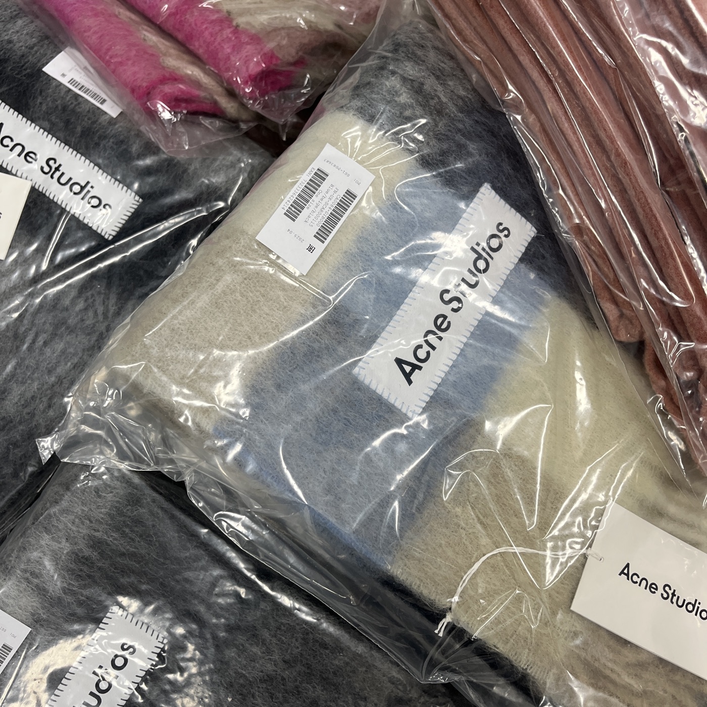Acne Studios scarves in packaging