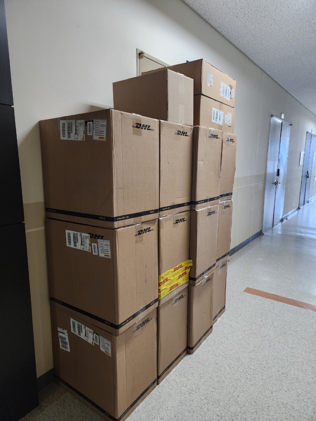 Stacked DHL shipping cartons